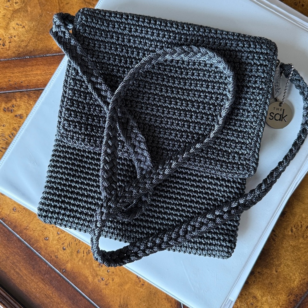 The SAK, like new crossbody purse. Woven, dark grey.